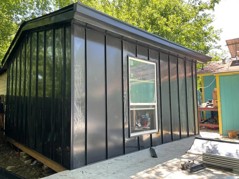 Black standing seam metal wall panels for Roof Inspection in Ramsey